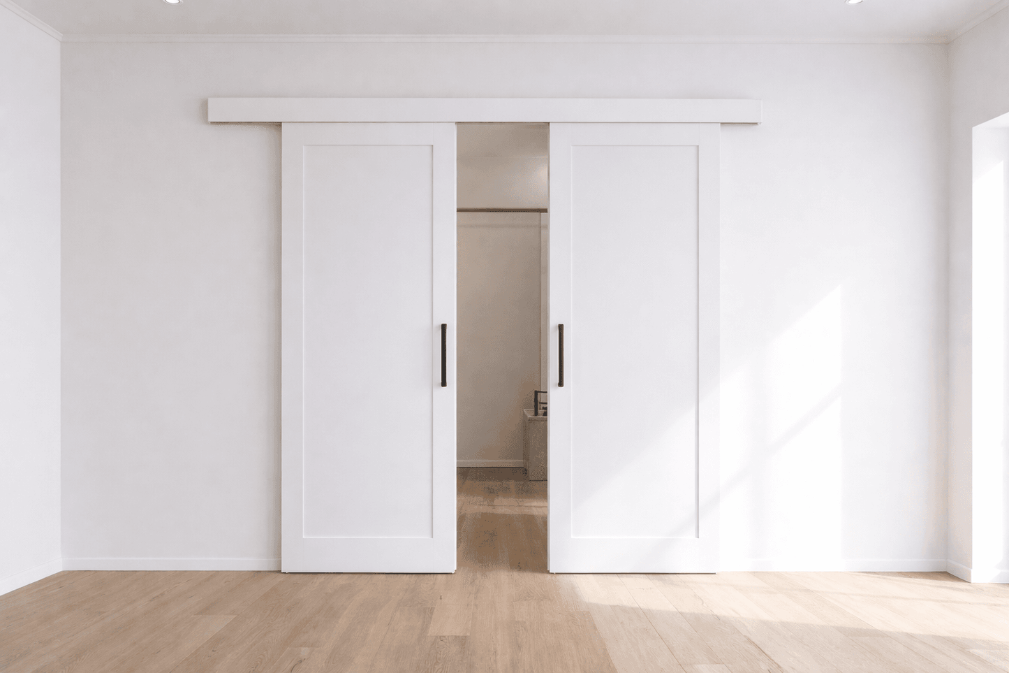 Modern interior with white sliding doors in a minimalistic room.